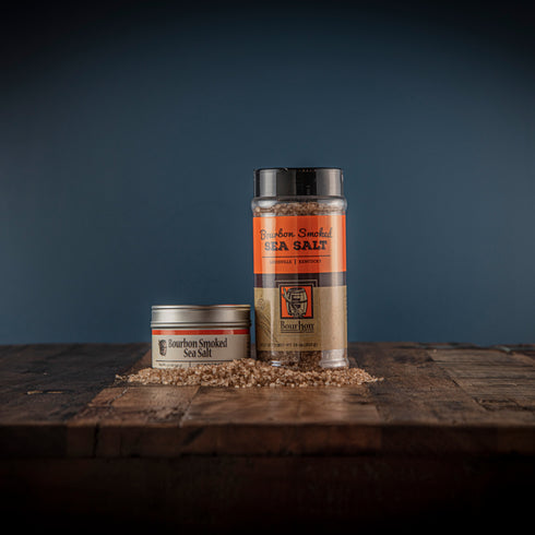 Bourbon Barrel Foods Bourbon Smoked Sea Salt in a tin and a shaker.